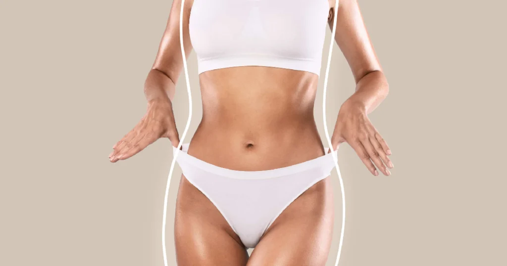 Waist-up shot of a slim woman adjusting her waistband, highlighting Emsculpt Body Contouring in Bonita Springs, FL.